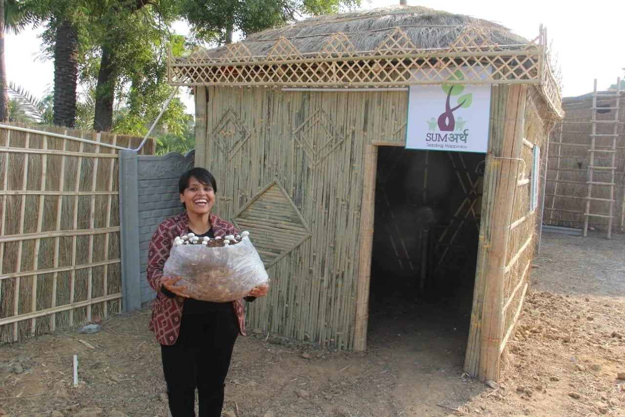 Mushroom cultivation outside SumArth’s bamboo and thatch hut