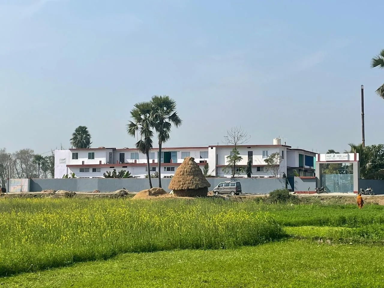 SumArth Kendra main centre beside green agricultural fields in Gaya